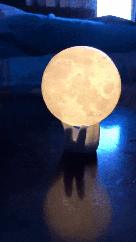 Gif of a reviewer's video showing the moon lamp