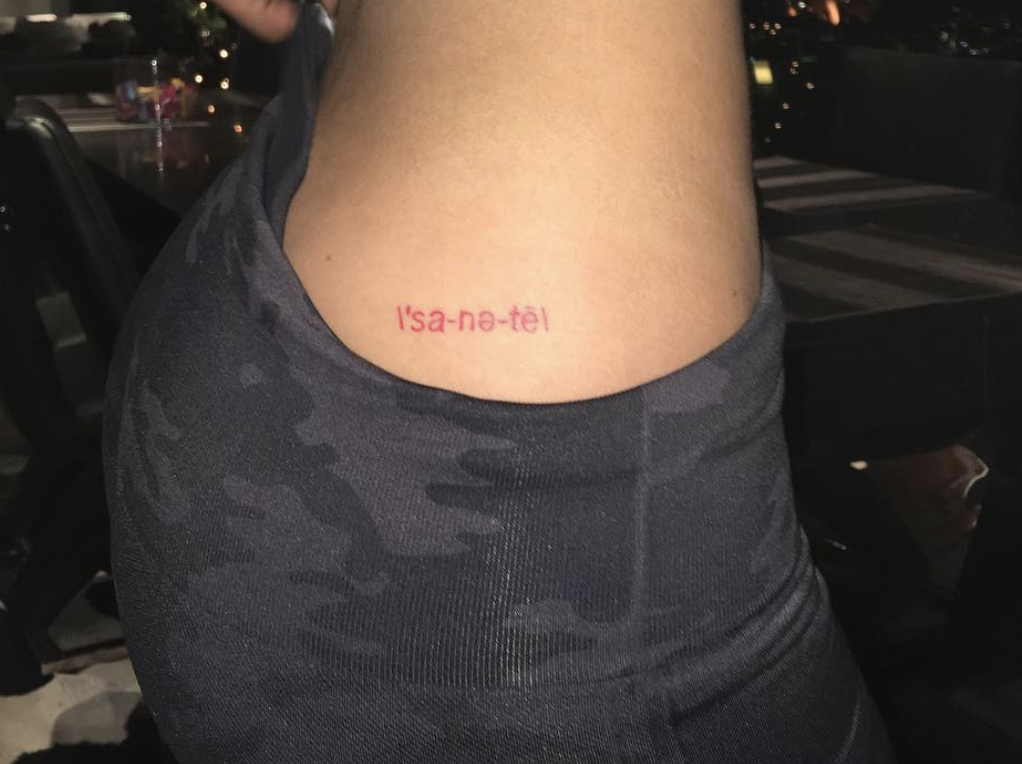 small red text tattoo