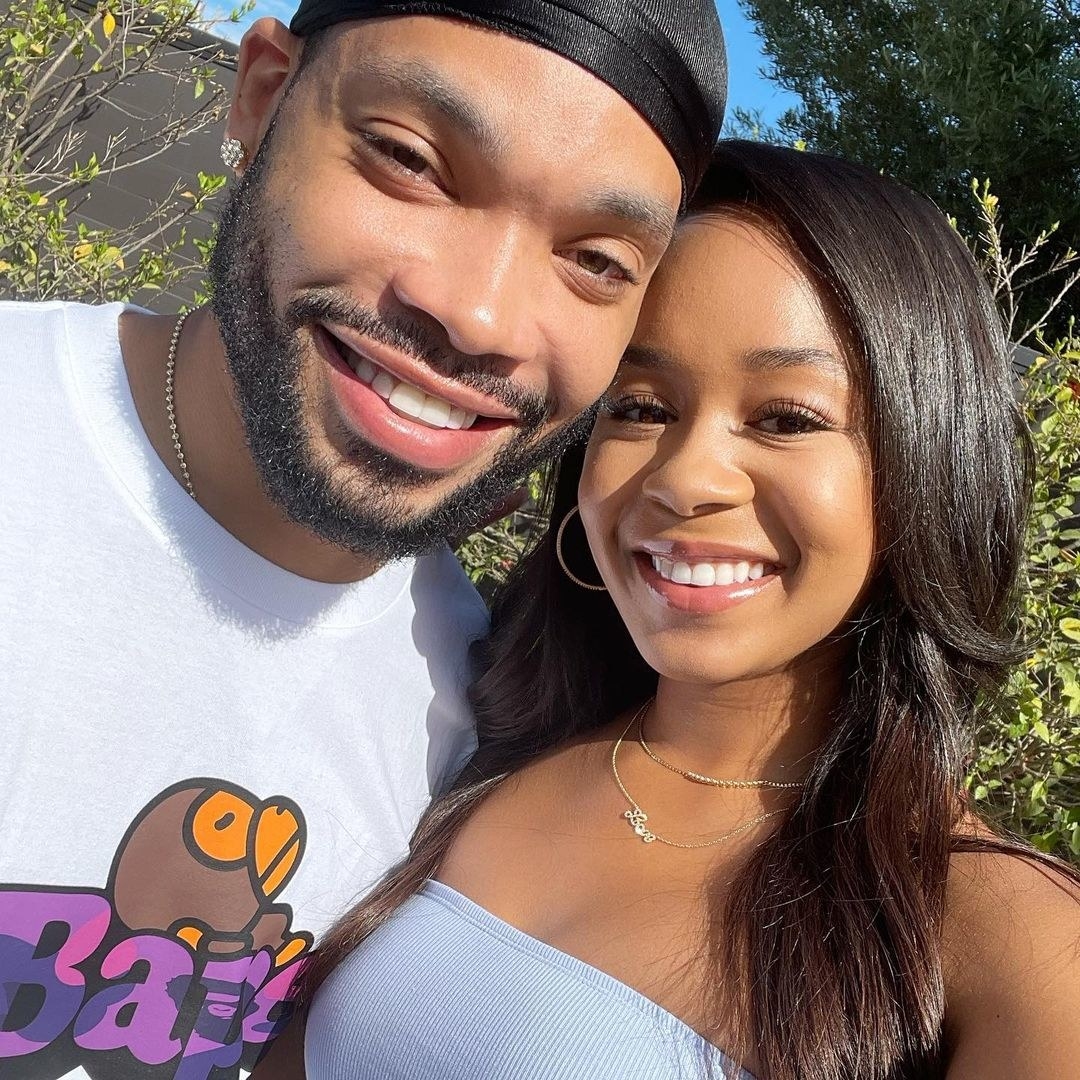 Eric and Jasmine smiling together outdoors