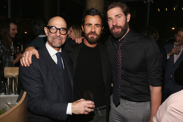 Stanley and John standing with Justin Theroux with their arms on each other&#x27;s shoulder