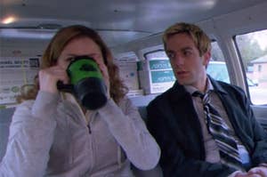 pam drinking a mug of coffee sitting next to ryan in a van
