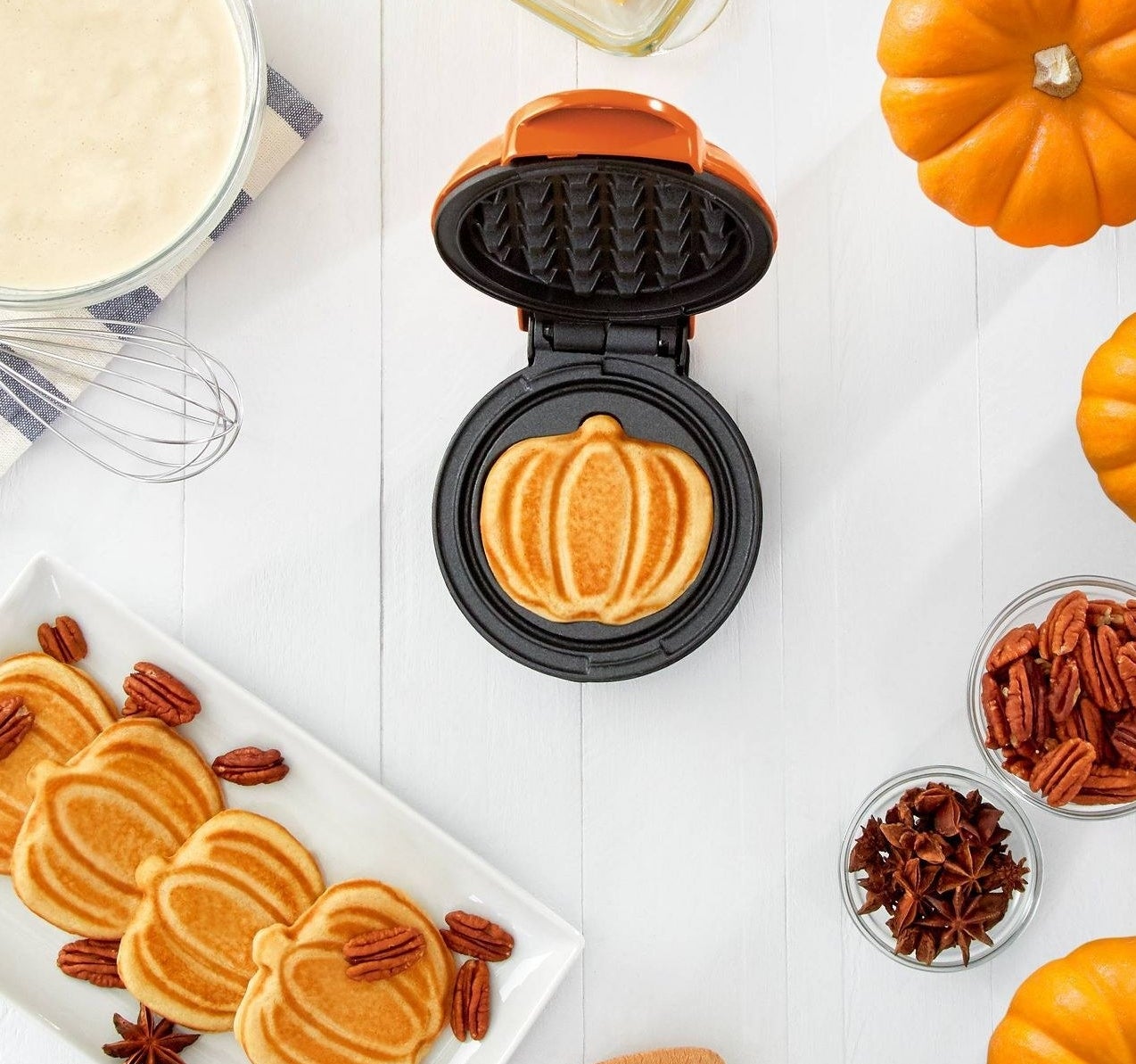 pumpkin-shaped waffles made using the orange griddle