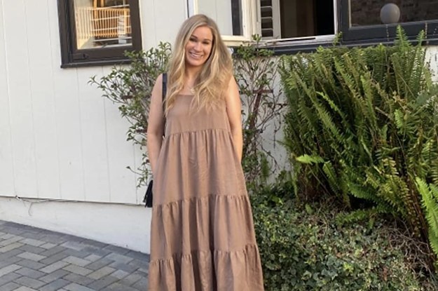 reviewer wearing the mushroom colored dress