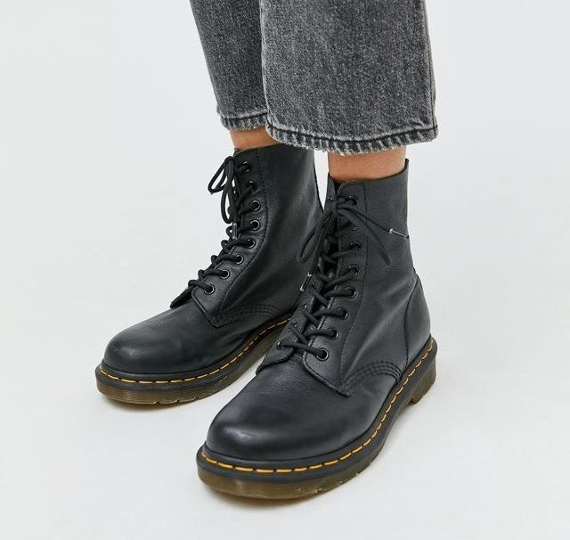 Legs wearing the boots in black