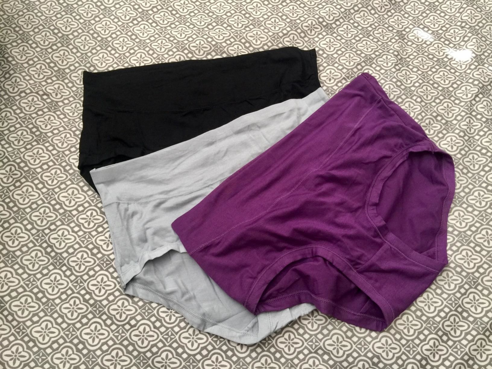 a pack of the undies in black, gray and purple