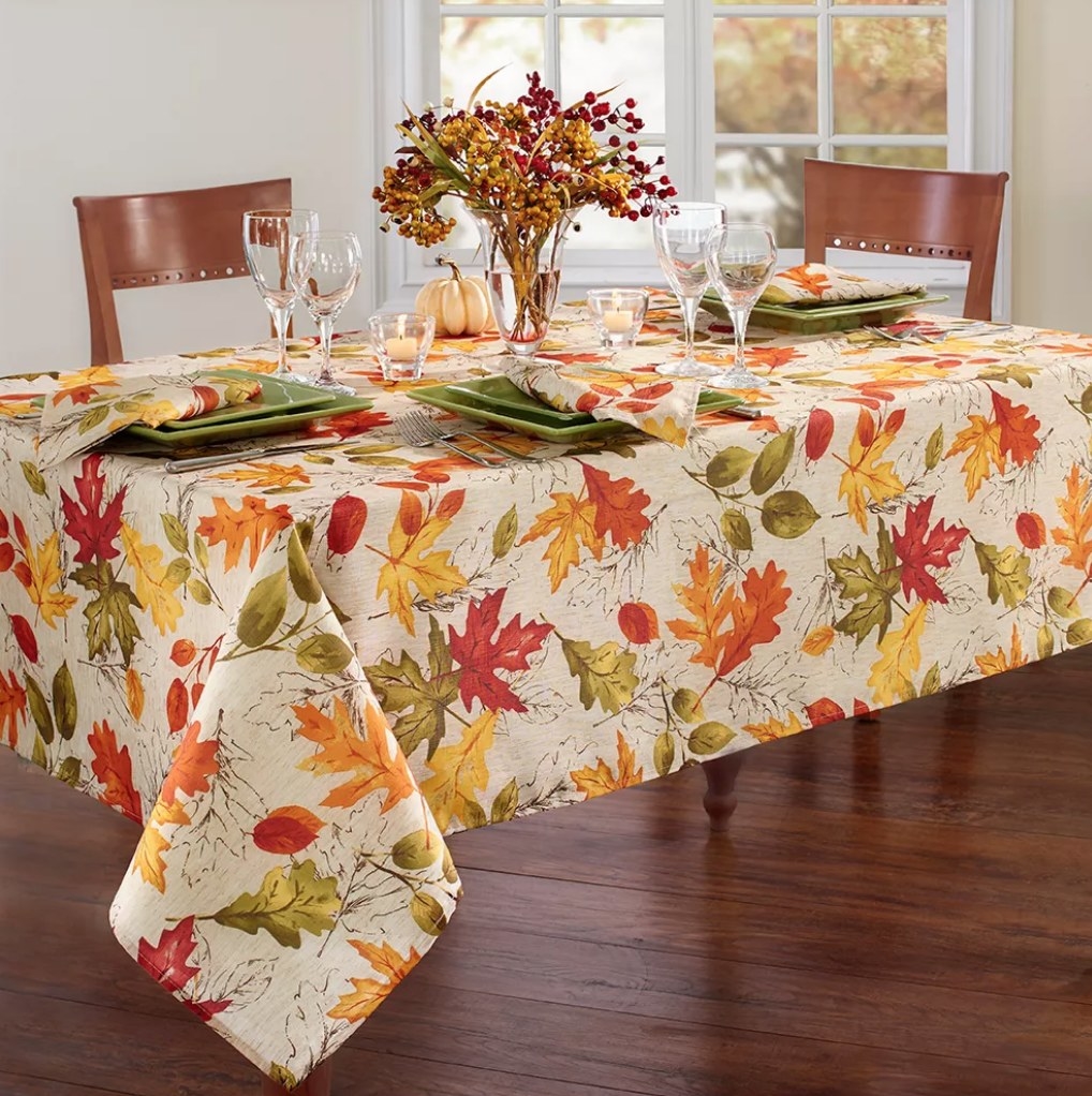 An orange/yellow/red autumn leaves printed tablecloth