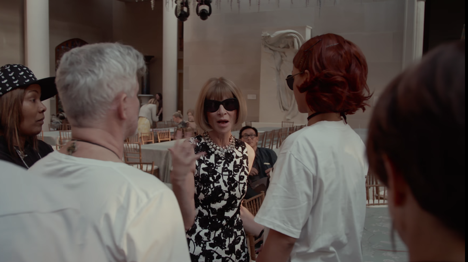 Anna Wintour talking to Rihanna and her team.