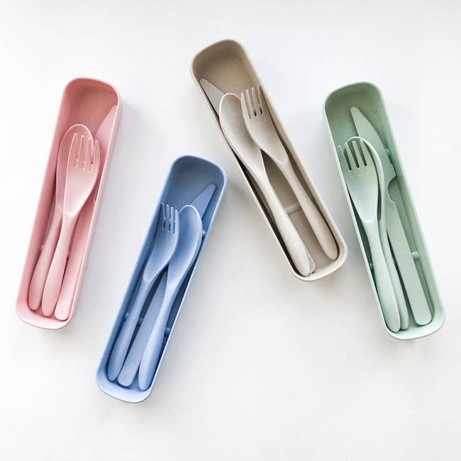 Set of four cutlery sets in various colors