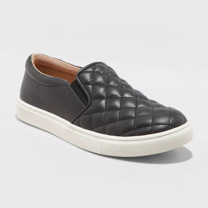 Black quilted faux-leather slip on sneaker with white sole