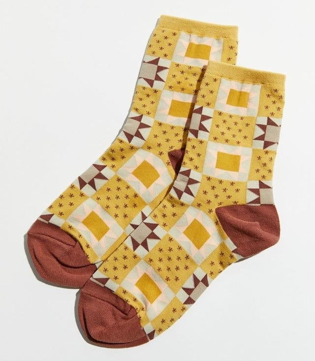 The socks in a yellow and brown pattern