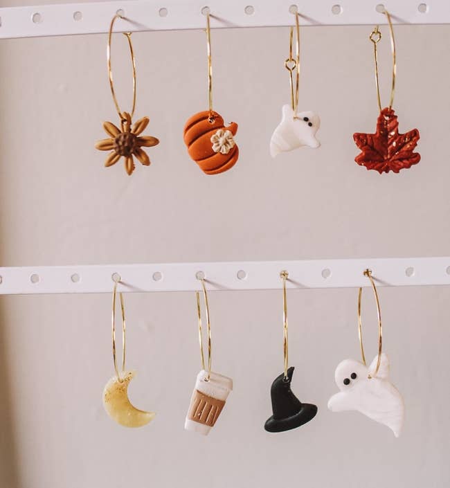 the different seasonal charms on gold hoops