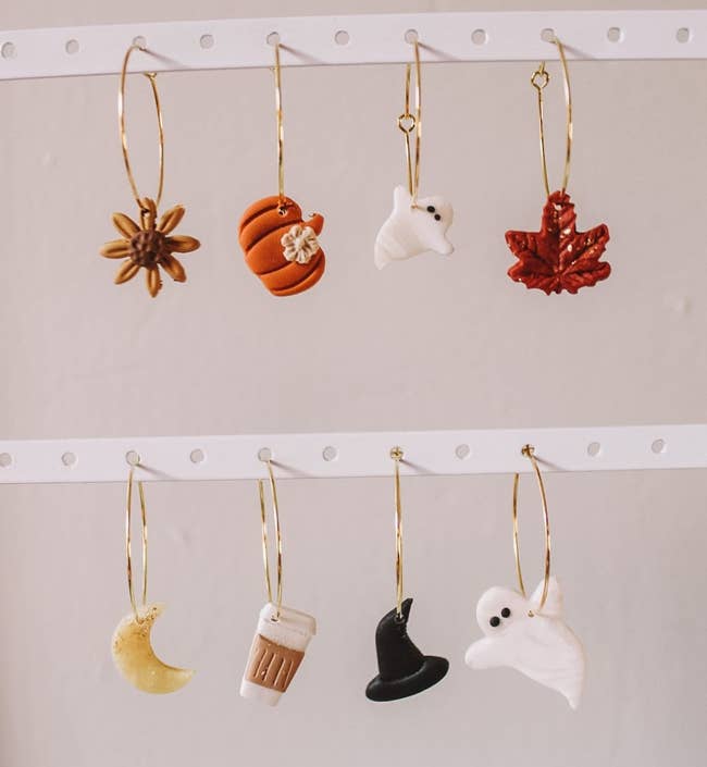 the different seasonal charms on gold hoops