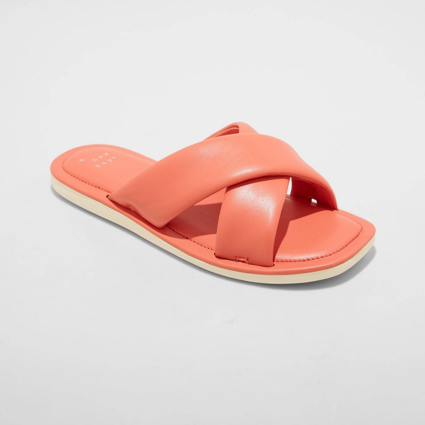 A coral crossband slide sandal
