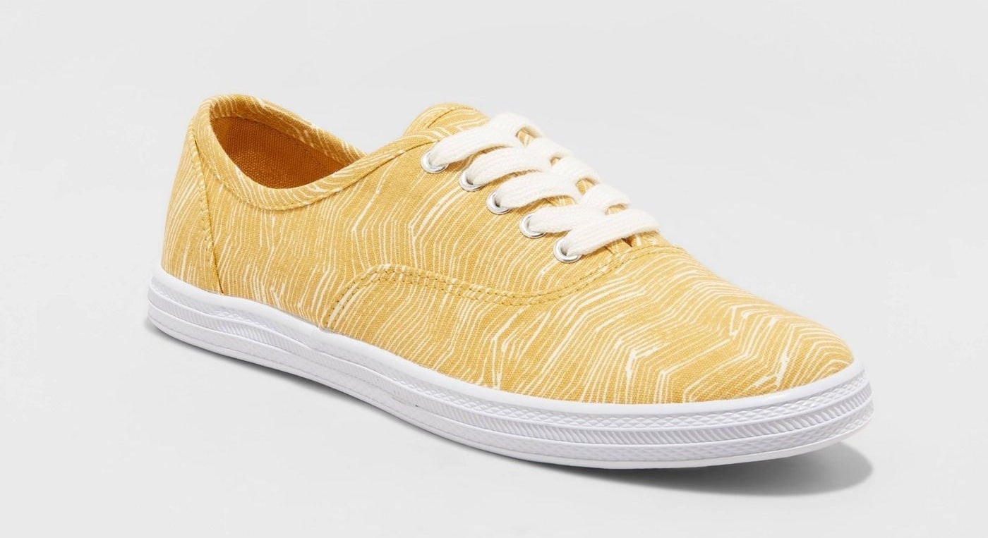 A yellow marble print canvas sneaker