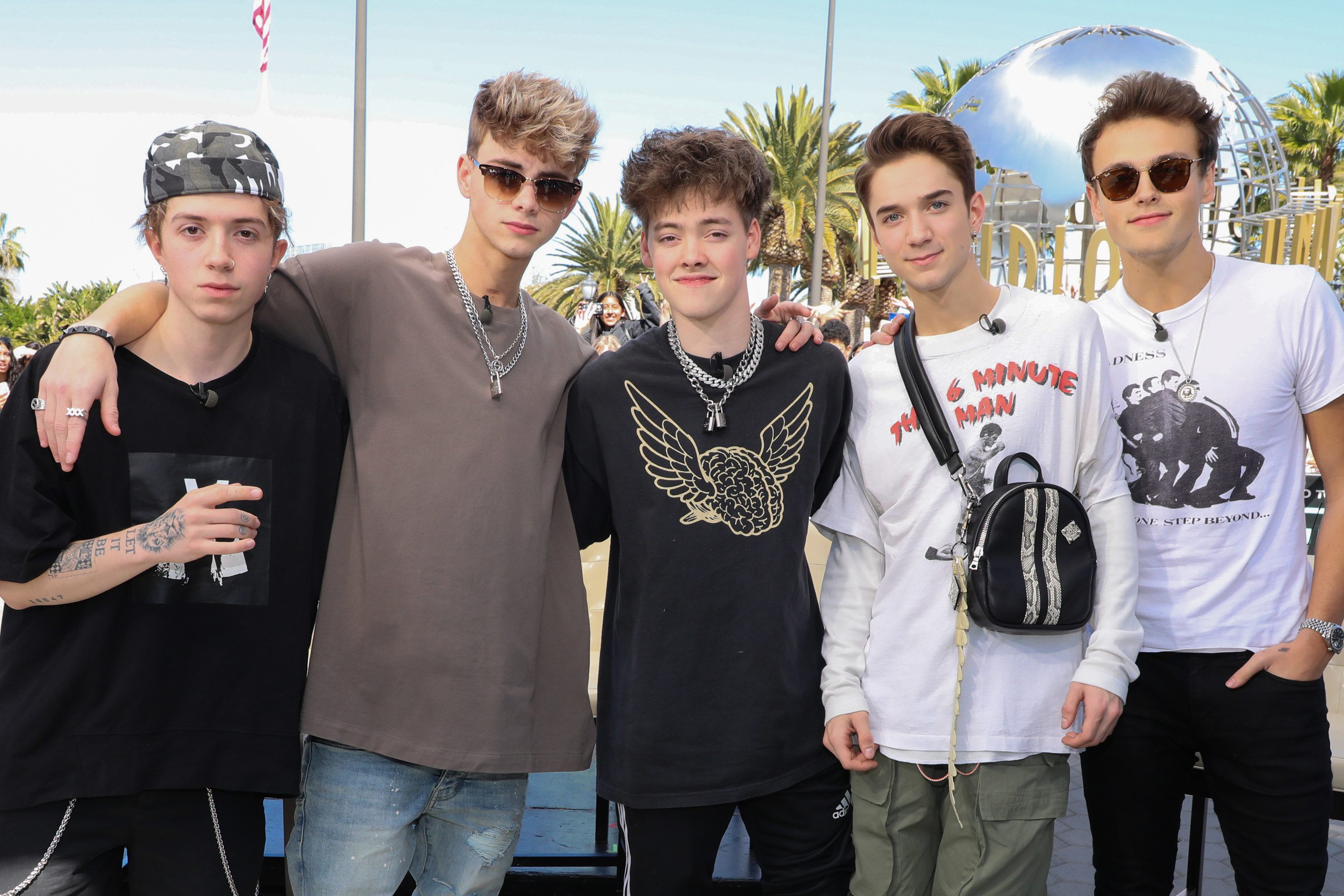 The band poses together at Universal Studios