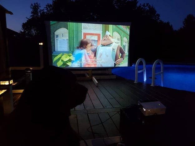 A reviewer's backyard setup with the projector screen