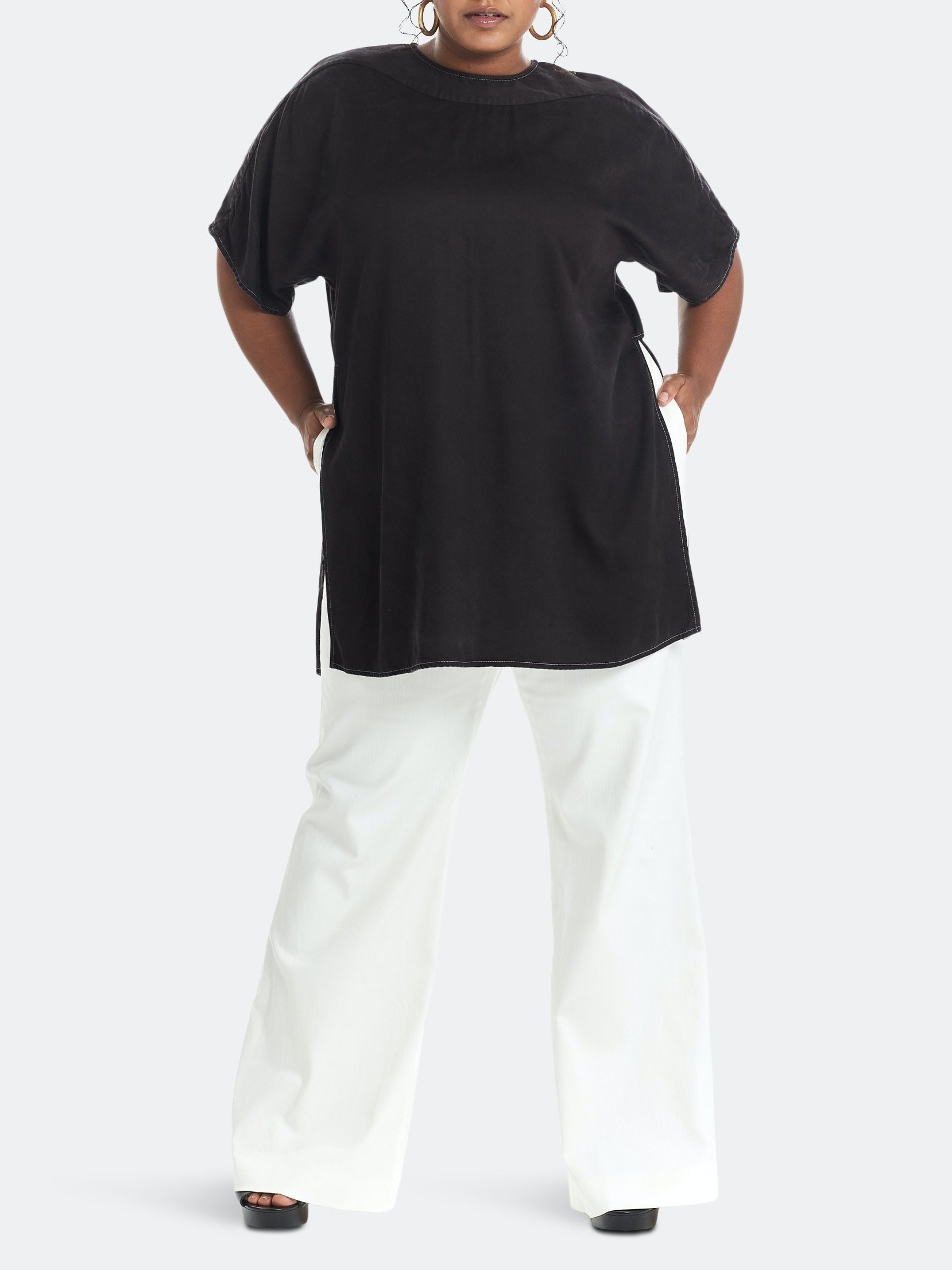 model wearing a black tunic