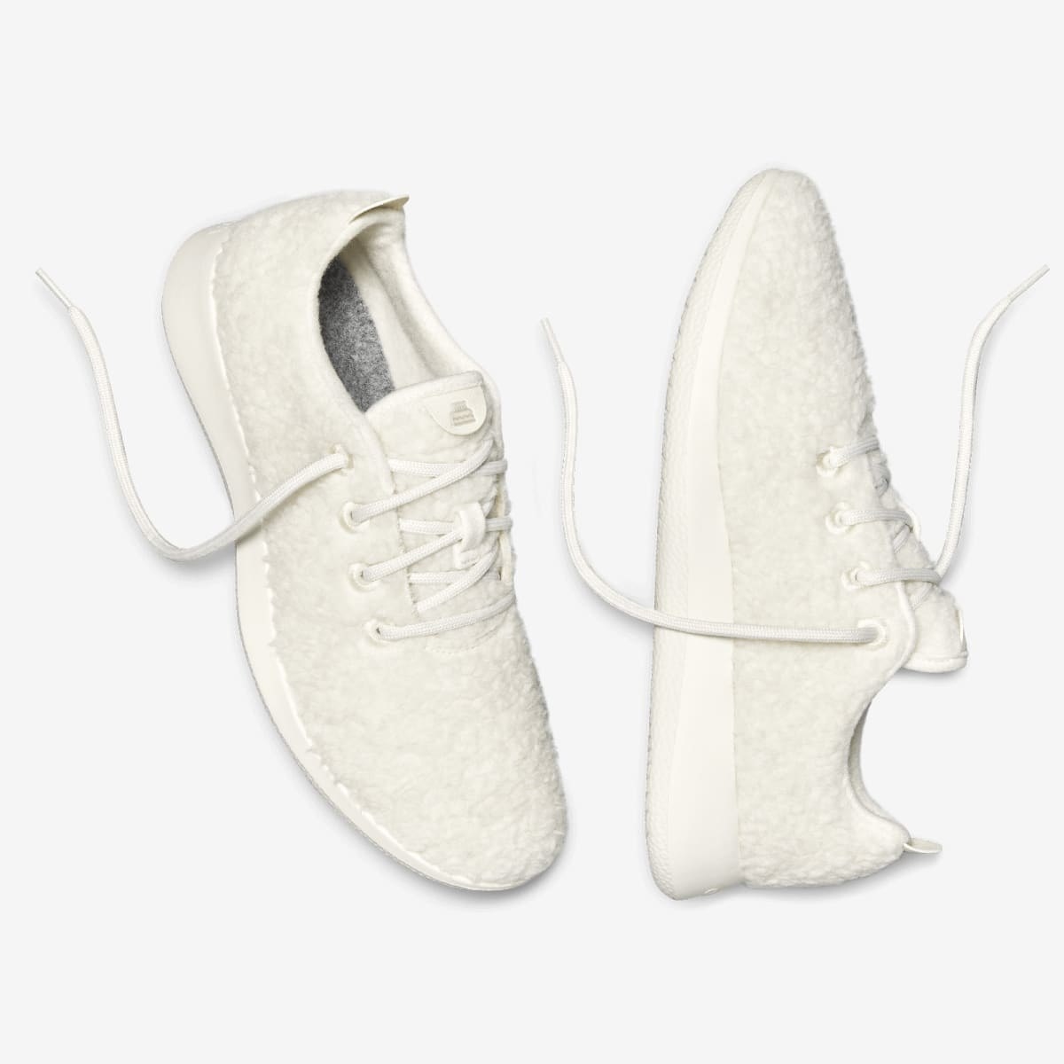 The cream, fluffy exterior lace-up sneakers