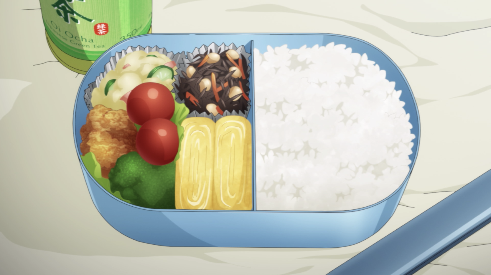A bento; this one is filled with rice, an omelette, a salad and some other sides