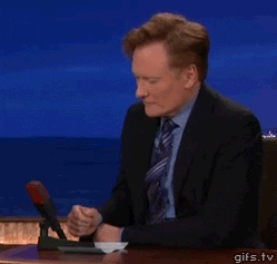 Conan looks uncomfortable at his late-night desk