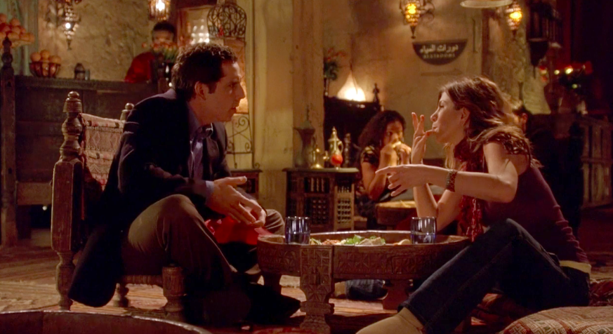 Ben Stiller and Jennifer Aniston sitting on the floor at a restaurant in &quot;Along Came Polly&quot;