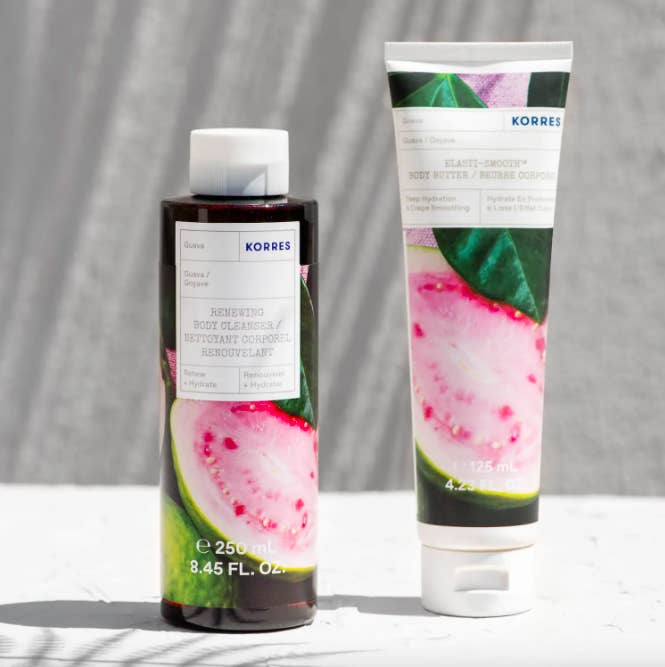 a bottle of cleanser and tube of lotion next to one another against a simple backdrop