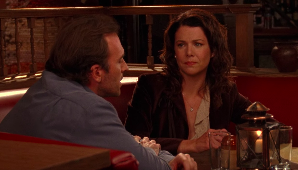 Lorelai and Luke sitting at dinner on &quot;Gilmore Girls&quot;
