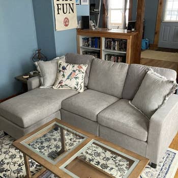 reviewer photo of beige couch in a living room