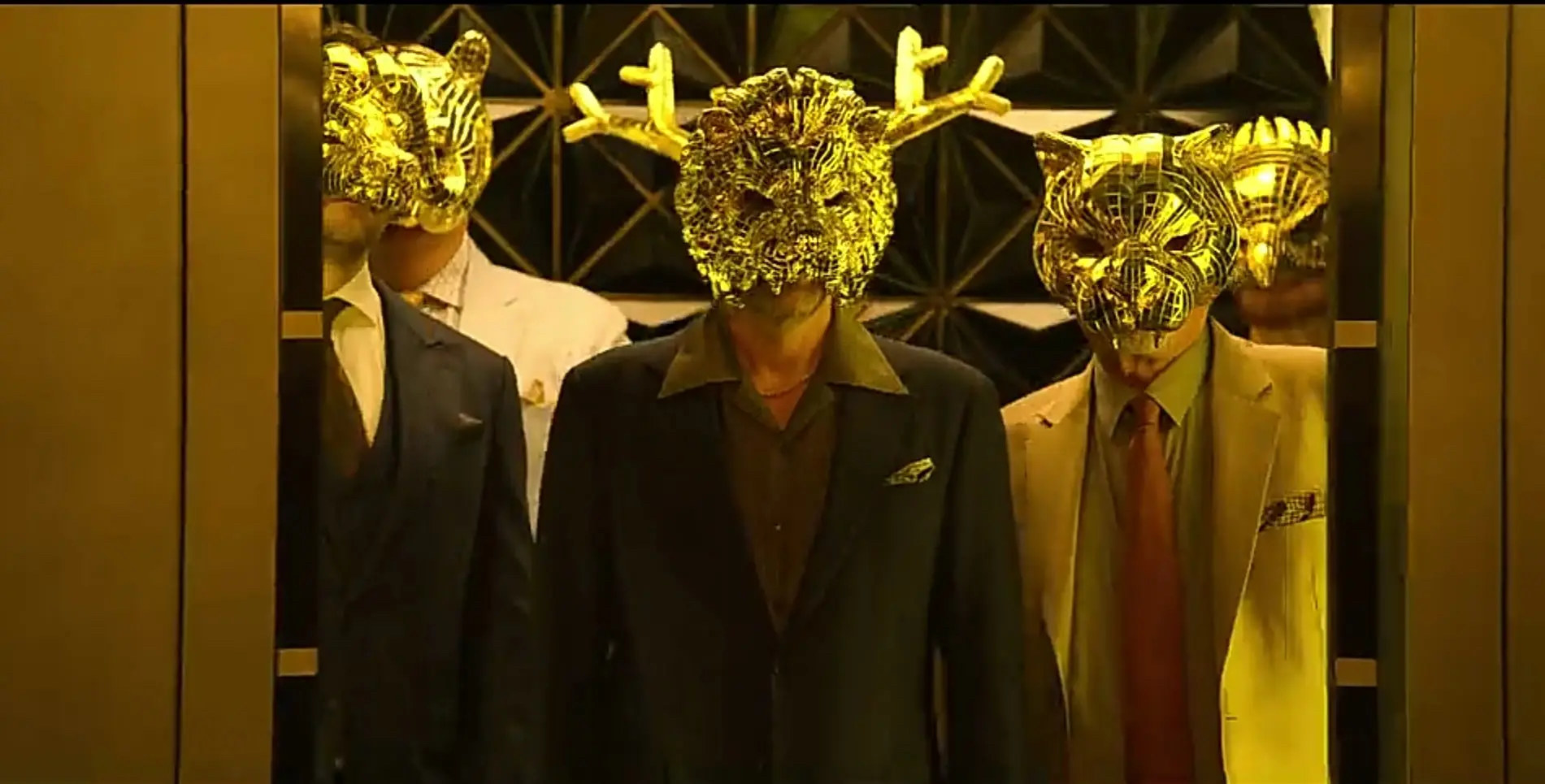 VIPs in golden animal masks.