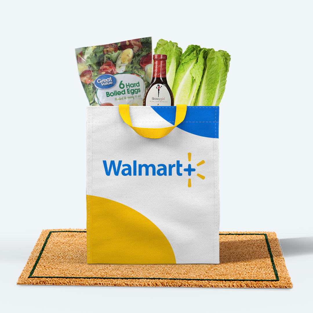 Walmart bag filled with groceries sitting on door mat