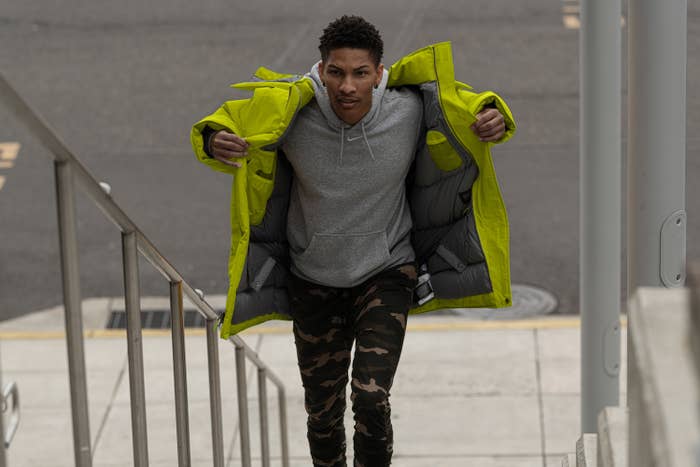 A man walking up stairs in a citronelle Mammoth parka.