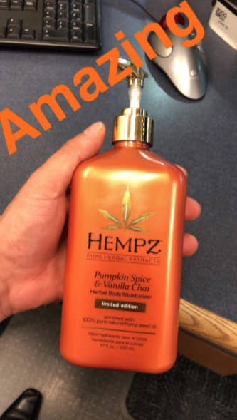 reviewer holding moisturizer