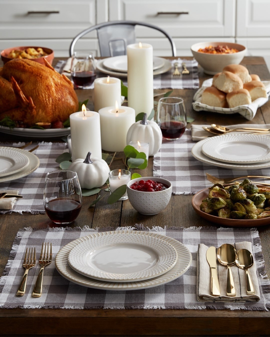 Holiday table set with food, cutlery, and placemats