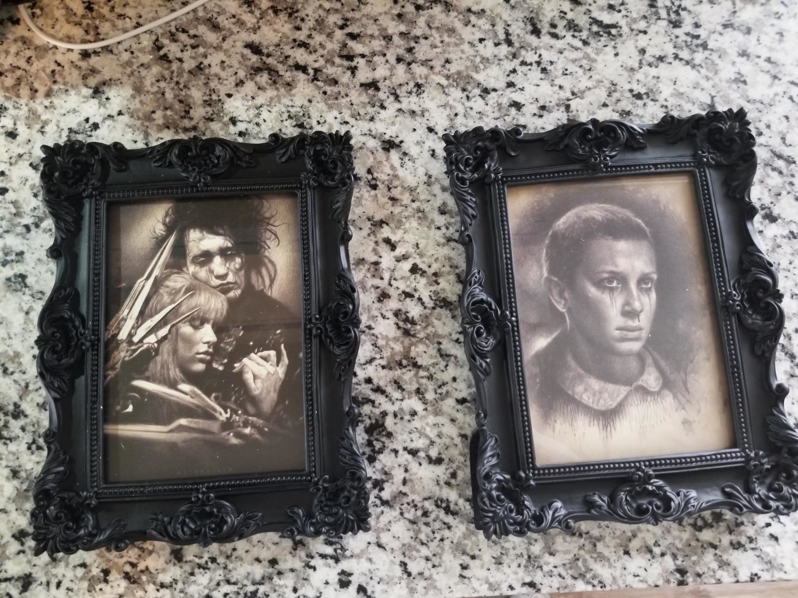 reviewer&#x27;s black frames with an edward scissorhands frame in one and an eleven from stranger things photo in the other one