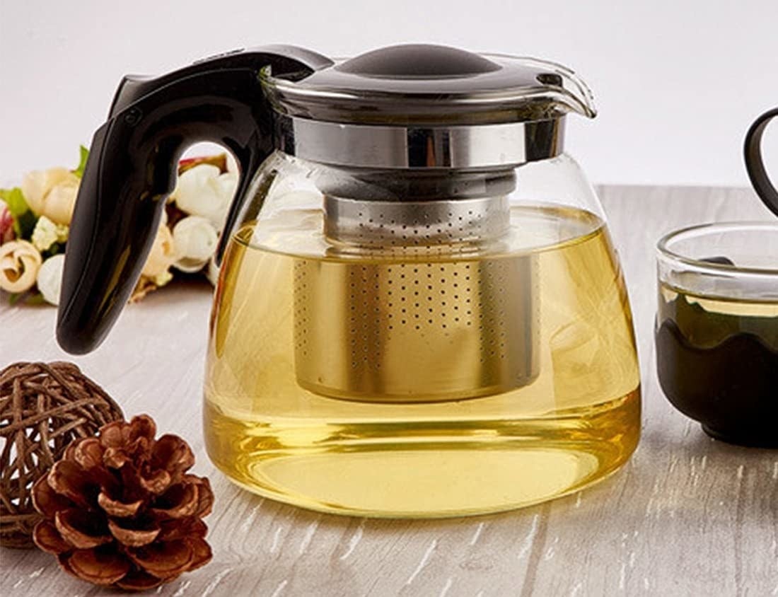 A tea infuser kettle with tea in it