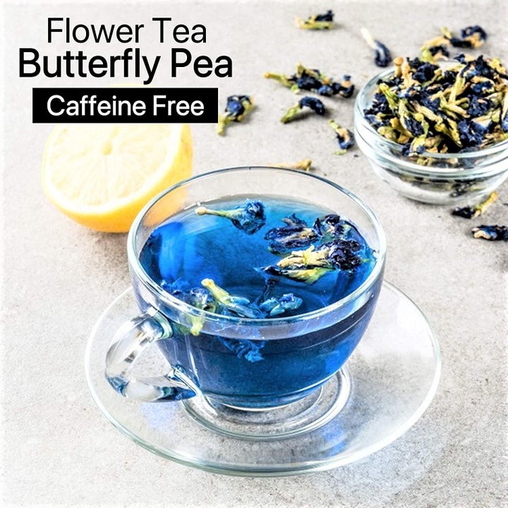 A teacup with blue tea in it