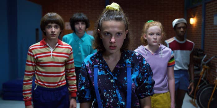 A scene from Stranger Things featuring the kids looking at something off-screen