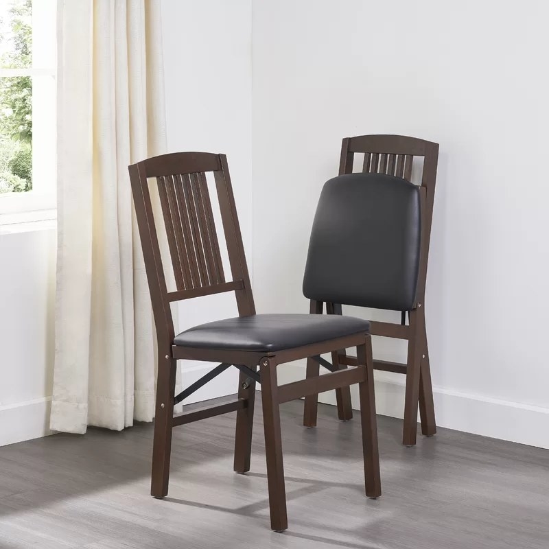 A pair of wood and upholstered cushion folding chairs
