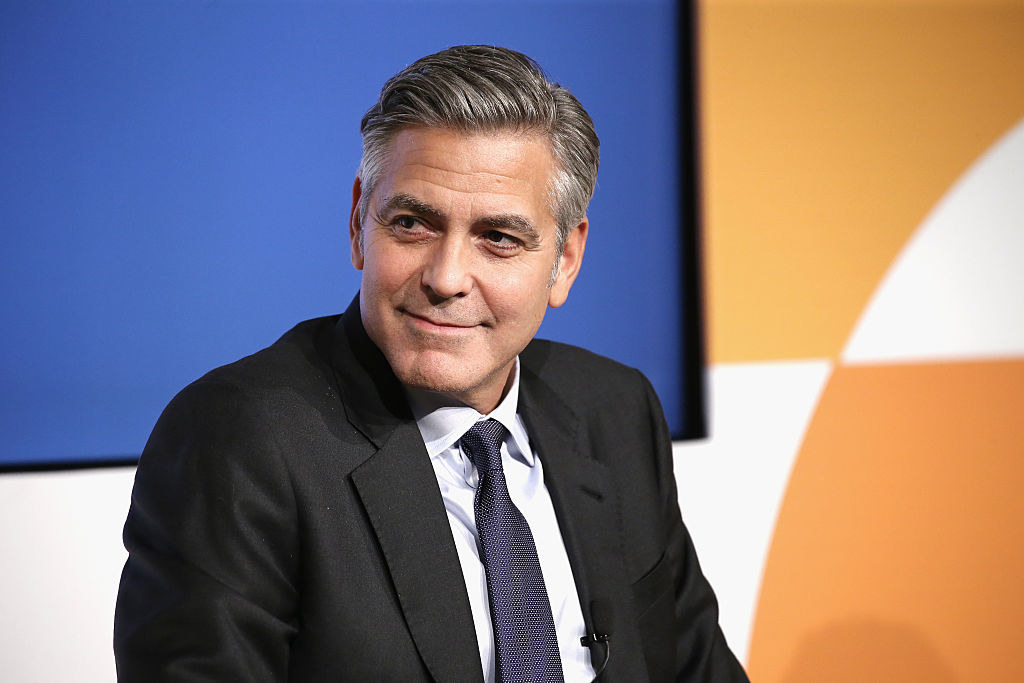 George Clooney speaks onstage at the 100 Lives initiative