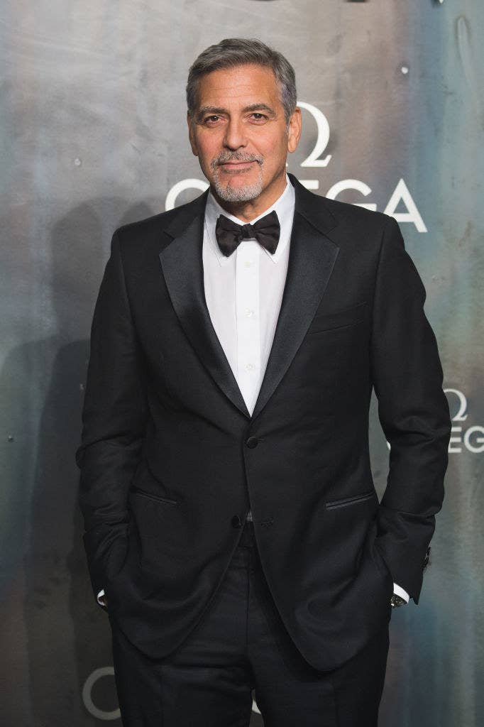 George Clooney in a suit and bow tie at the Lost In Space event to celebrate the 60th anniversary of the Omega Speedmaster, which has been worn by every piloted NASA mission since 1965
