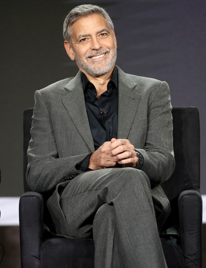 George Clooney sits with legs crossed during the Hulu segment of the 2019 Winter Television Critics Association Press Tour
