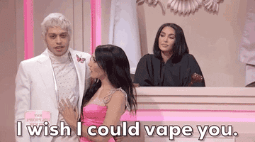 GIF of Pete/MGK and Chloe/Megan tongue-kissing with the caption, &quot;I wish I could vape you&quot;