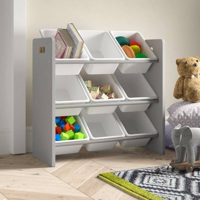 A toy organizer with nine storage bins