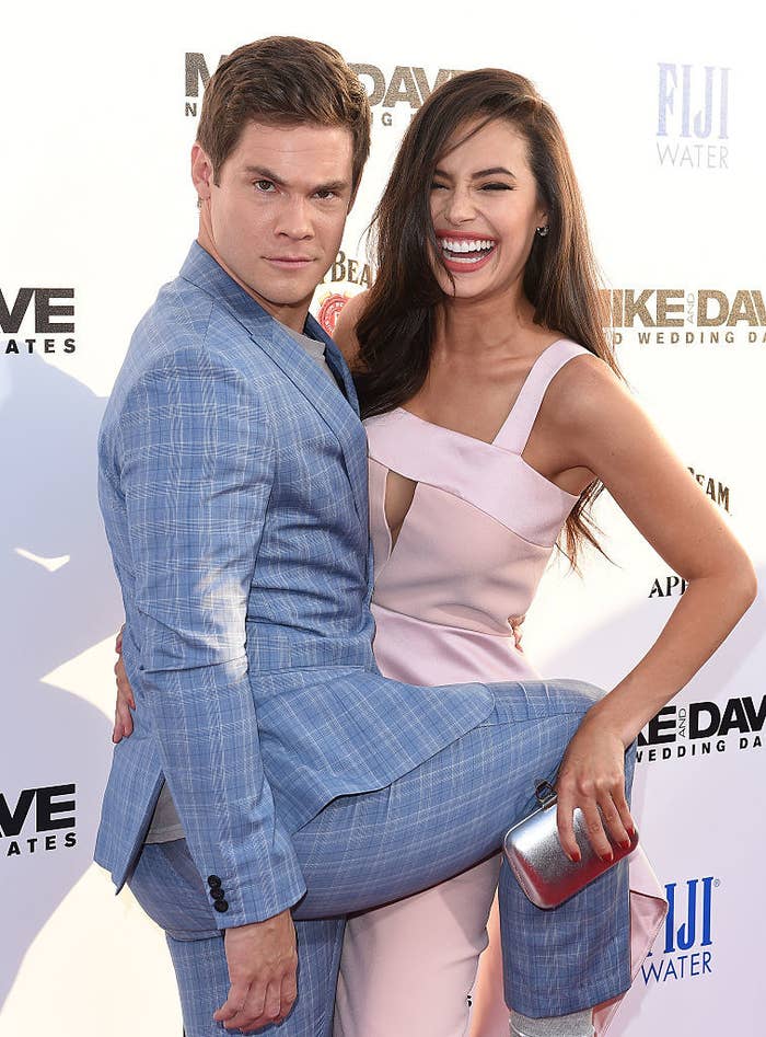 Adam and Chloe being playful on the red carpet