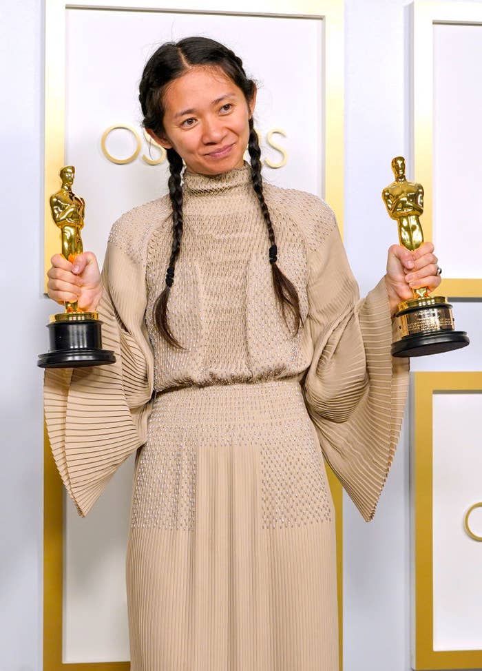 Chloé posing with her two Oscars