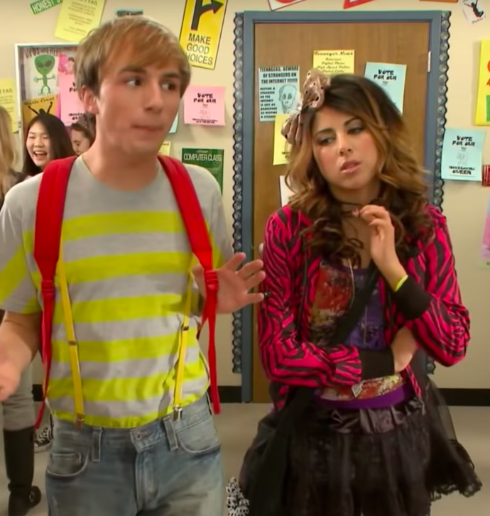 Fred and Judy walk down the hall of school