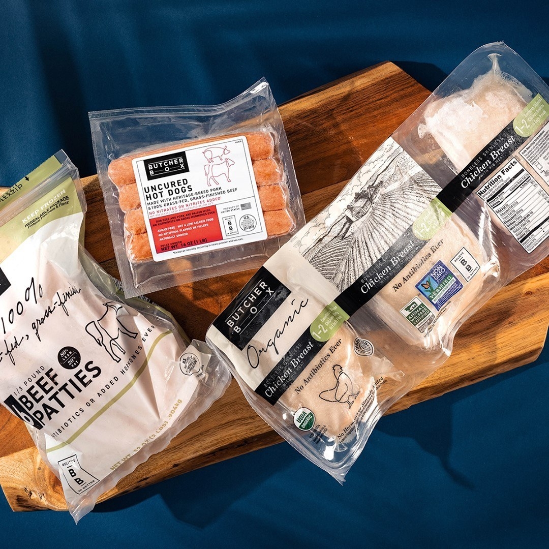 assortment of meat from butcherbox including beef patties, chicken breast and uncured hot dogs