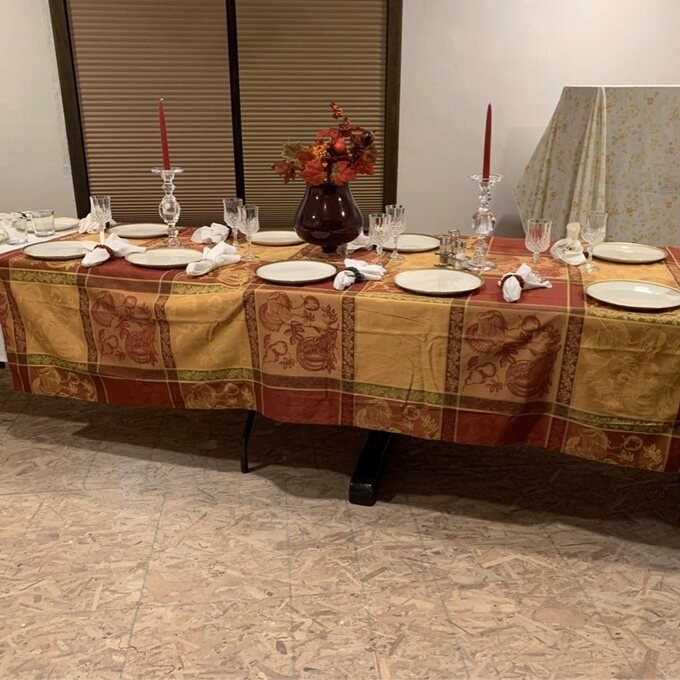 A reviewer&#x27;s photo of the tablecloth set for Thanksgiving