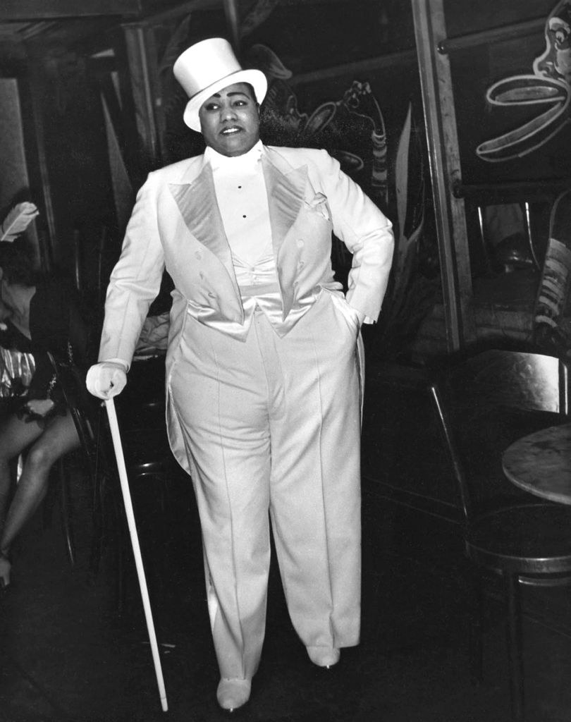 Gladys Bentley standing in men&#x27;s clothing backstage