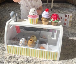 reviewer's child playing with the ice cream counter